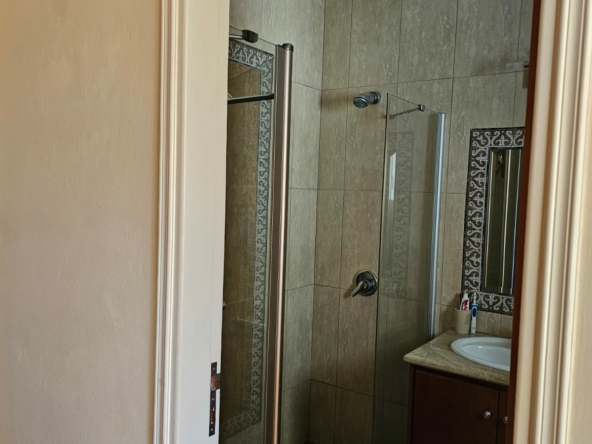 Hauson Realty - Cyprus Real Estate Agents A bathroom with a shower stall and a sink.