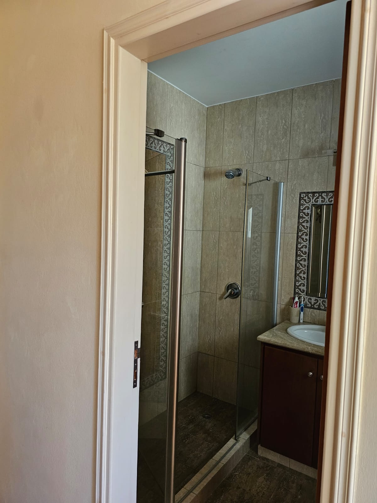 Hauson Realty - Cyprus Real Estate Agents A bathroom with a shower stall and a sink.