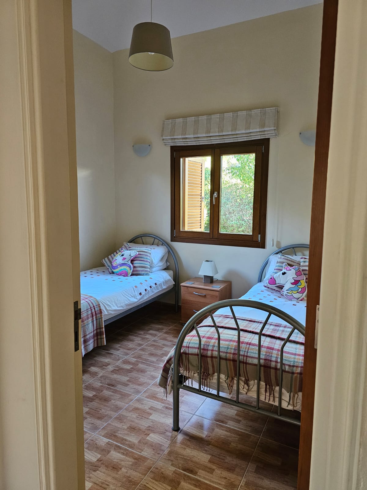 Hauson Realty - Cyprus Real Estate Agents A bedroom with two beds and a window.