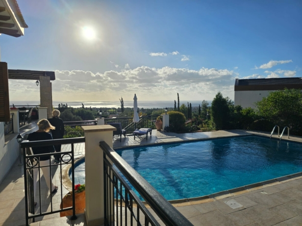 Hauson Realty - Cyprus Real Estate Agents A house with a swimming pool and a view of the sea.