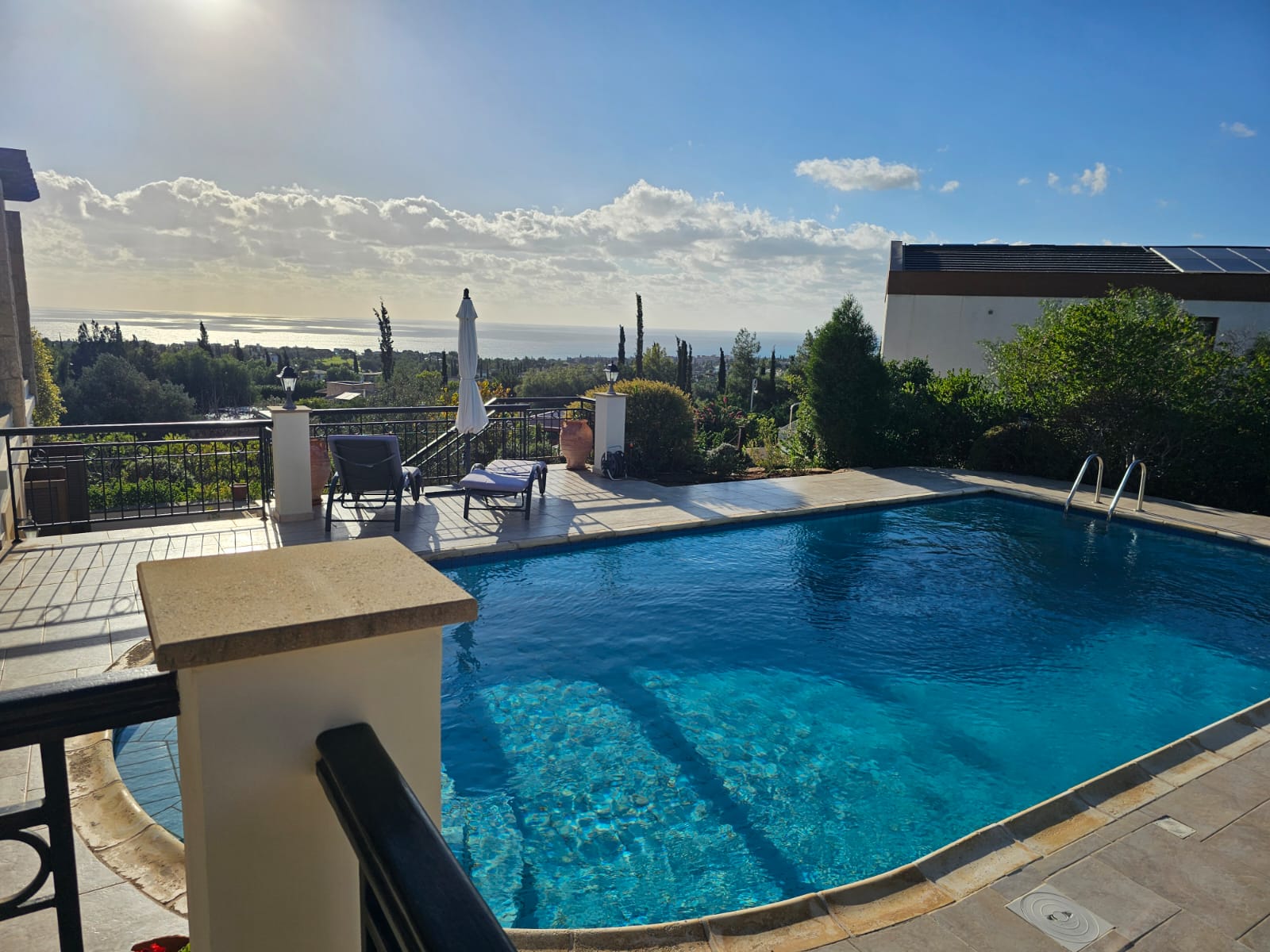 Hauson Realty - Cyprus Real Estate Agents A villa with a swimming pool overlooking the sea.